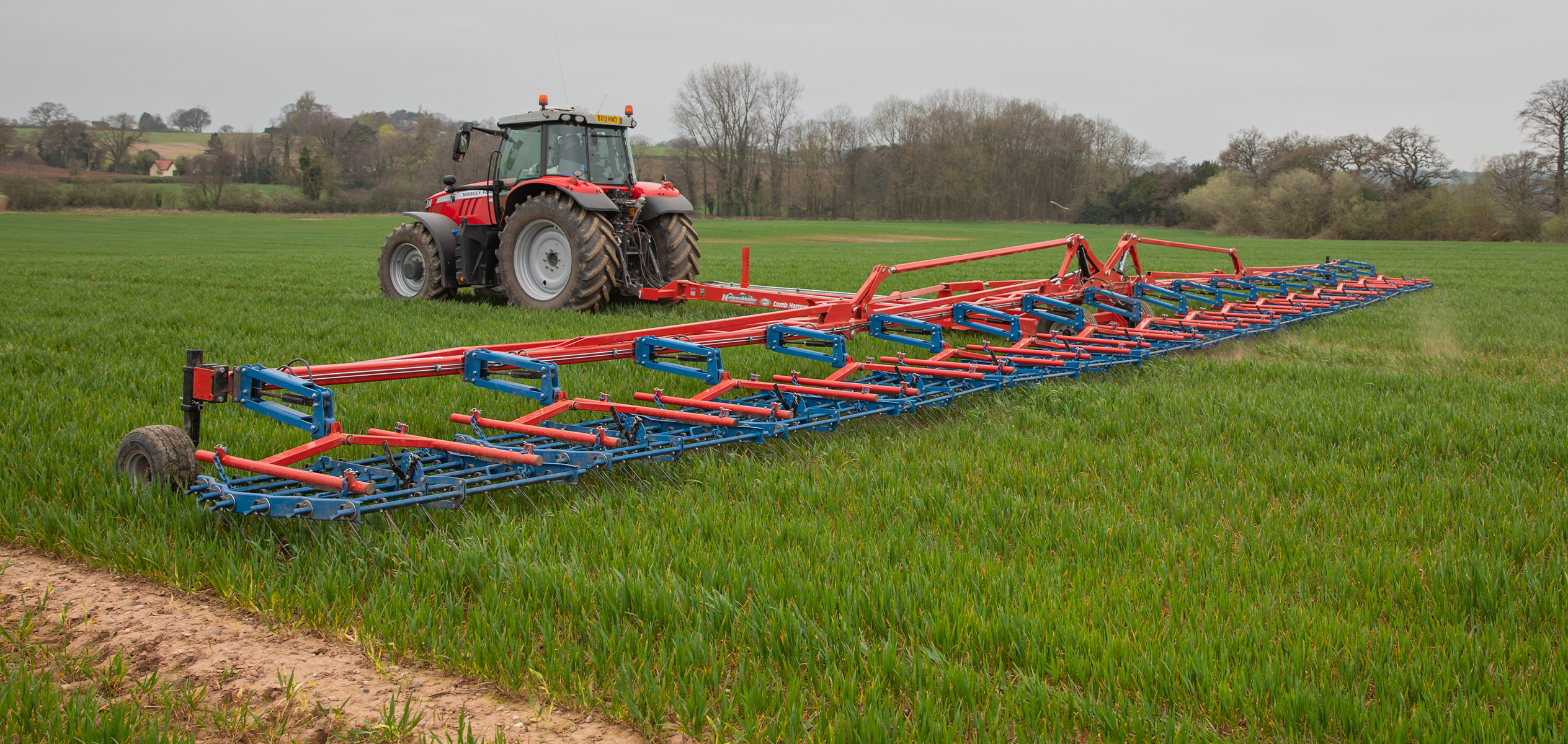 24m Semi-mounted OPICO Comb Harrow in field of combineable crops