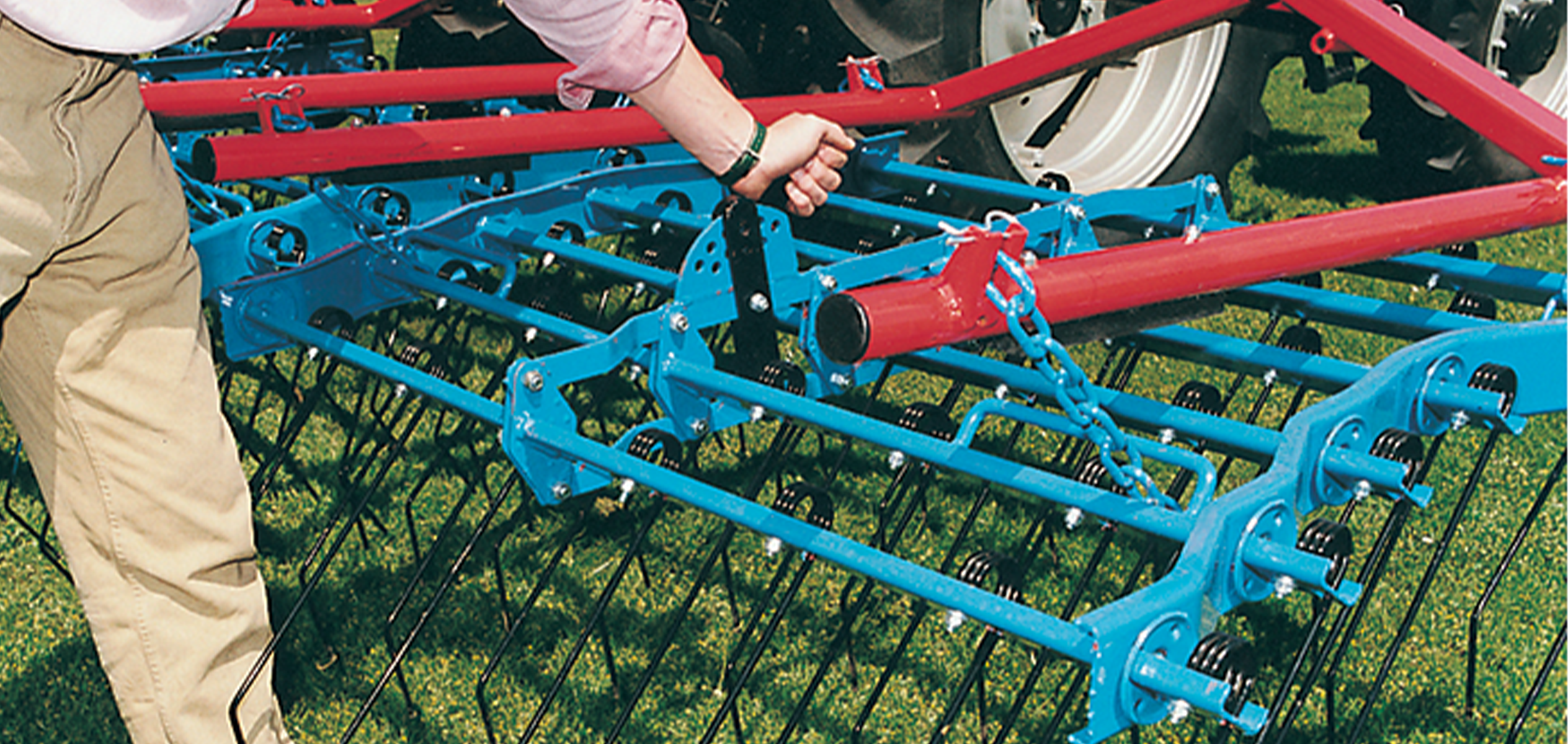 Grass harrow tine adjustment